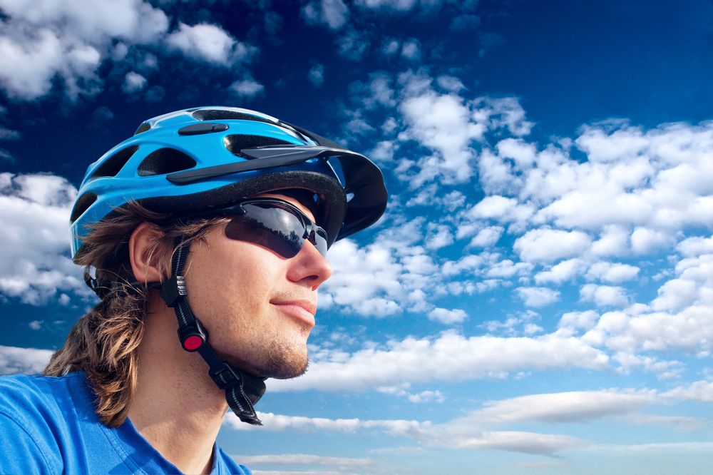 portrait young bicyclist helmet wear sunglasses